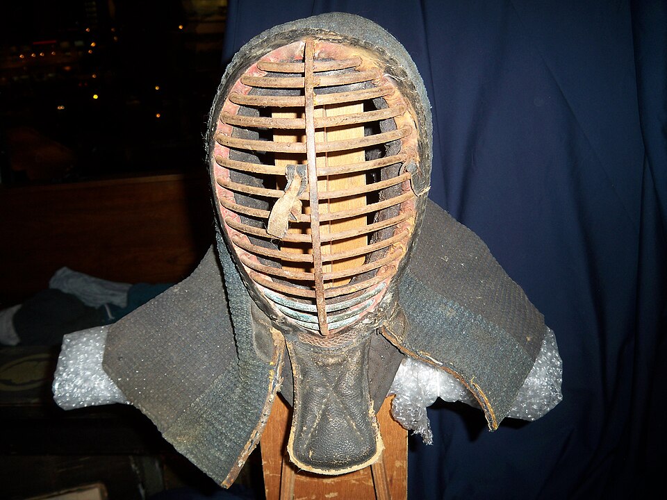 Antique kendo men showing the iron grille and traditional construction
